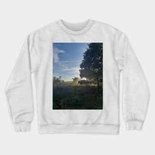 Combine harvester at sunset Cap Crewneck Sweatshirt